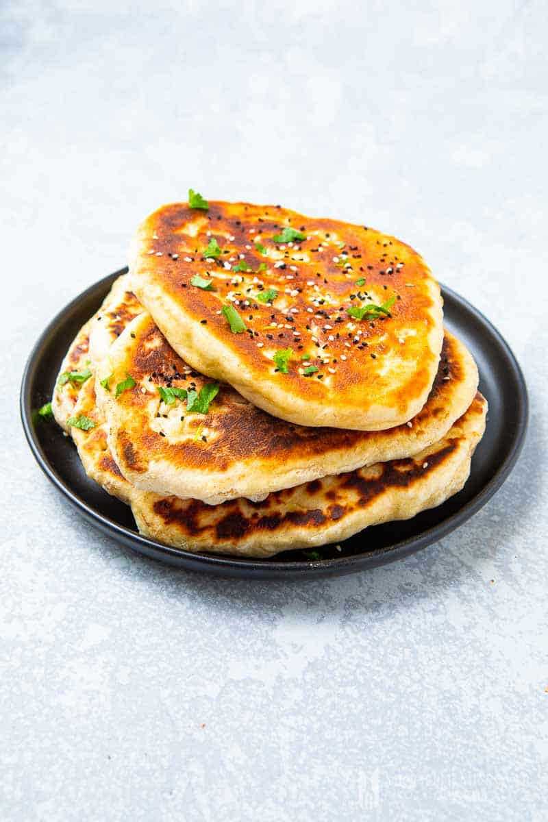 Plate of pan fried naan bread.