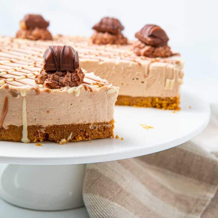Full Kinder Bueno Cheesecake with a slice removed