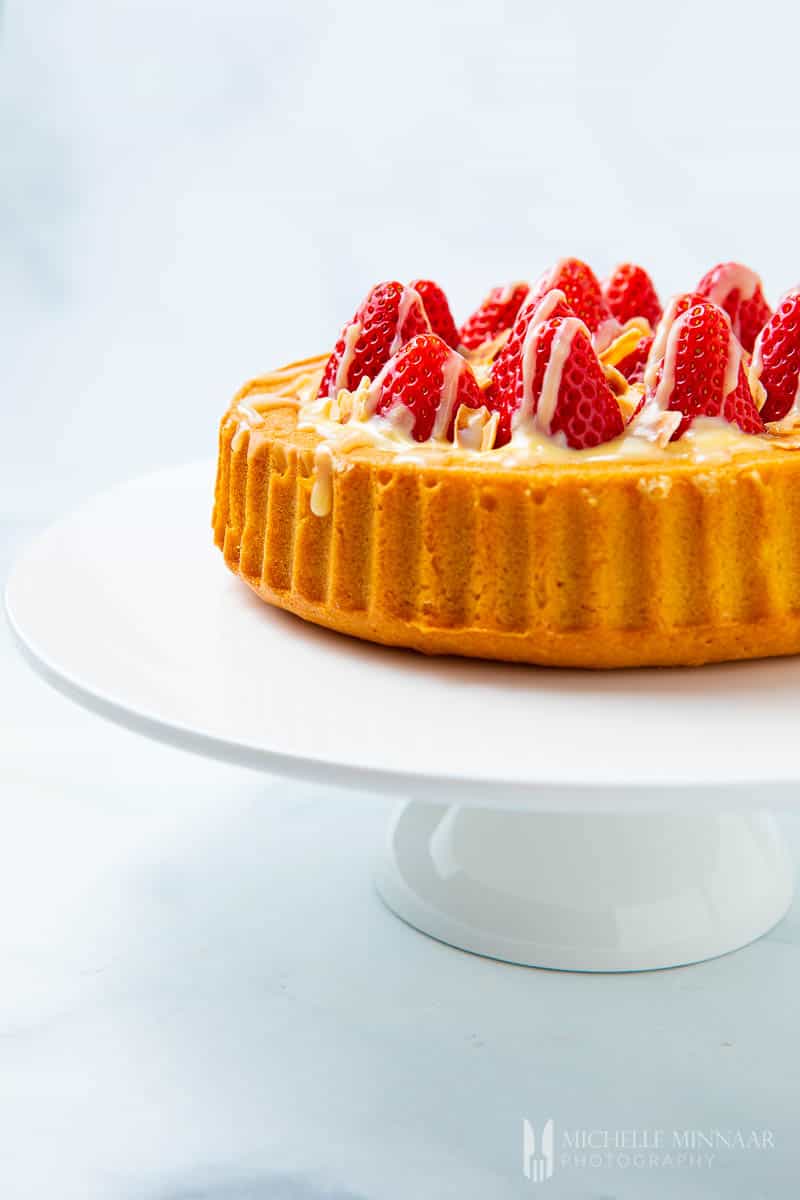 Whole side view of a strawberry flan cake