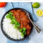 Bowl of beef madras with a side of white rice