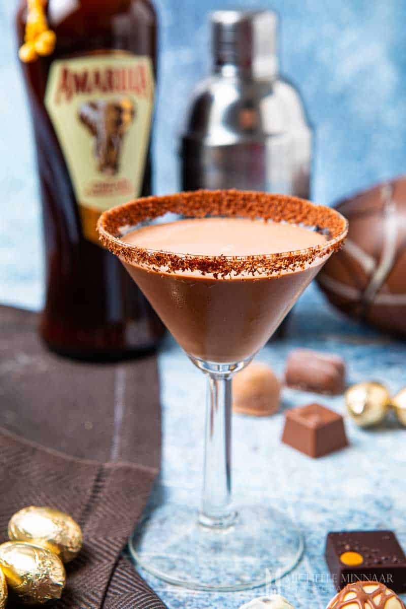 Martini glass rimmed with chocolate sugar and liquid amarula inside