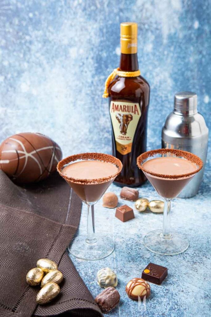Two glasses of chocolate amarula cocktail and a bottle of Amarula