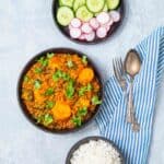 Full indian meal of curry, rice and fresh vegetables