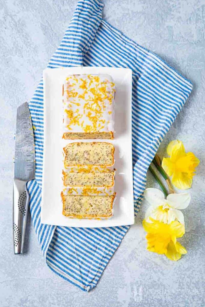 Sliced chia seed cake with yellow flowers