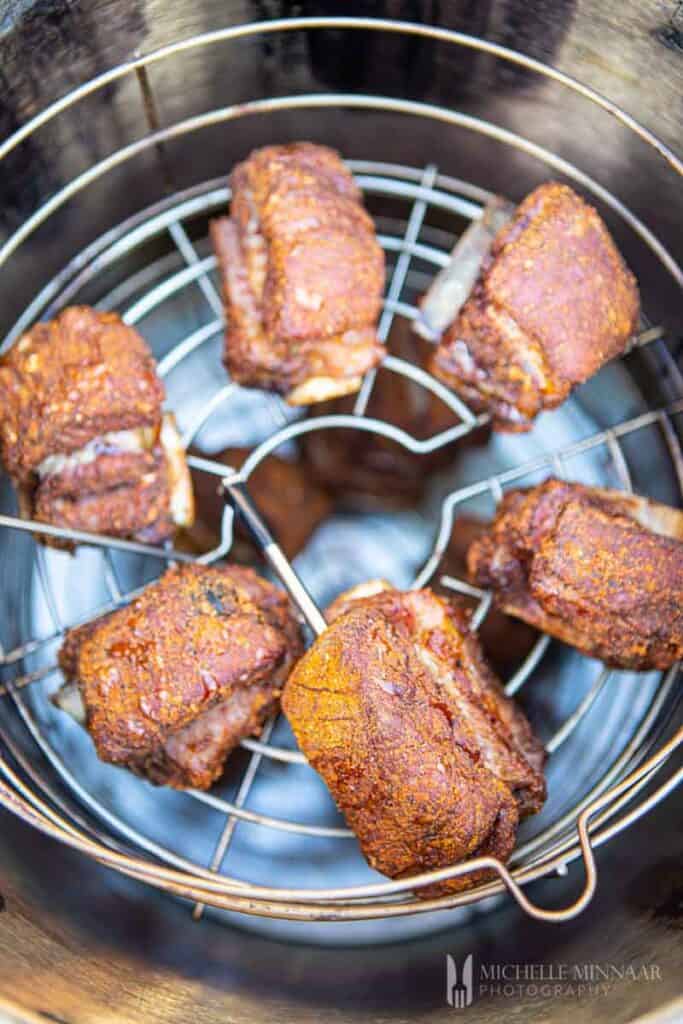 Ribs smoking in a smoker