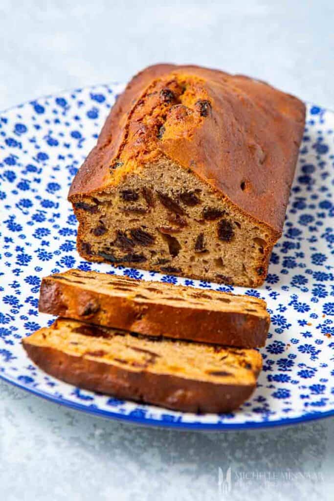 Loaf and slices of a brown baked weetabix cake