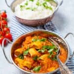 Bowl of chicken pathia and naan bread