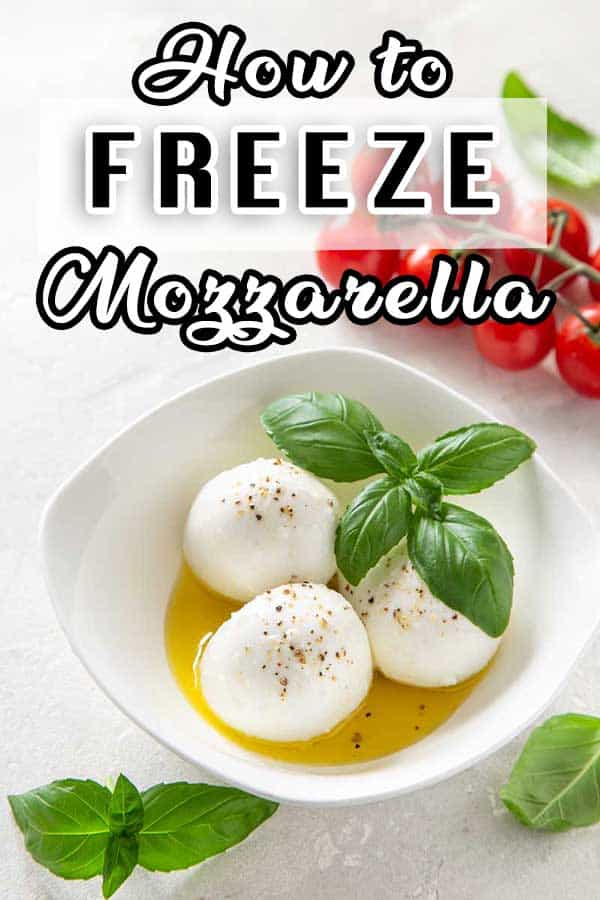 Three Mozzarella Balls in a bowl with basil and tomato