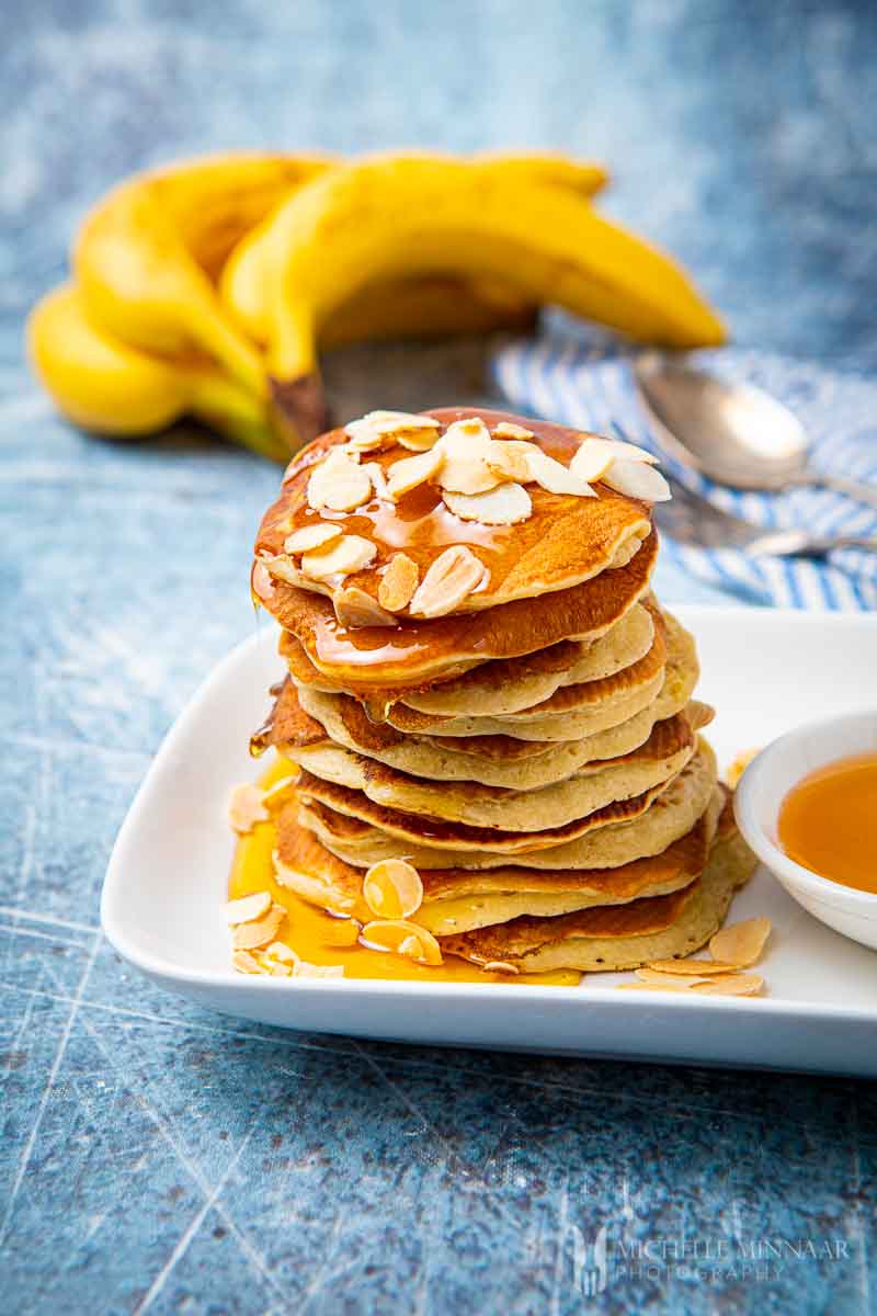Pile of banana pikelets with syrup