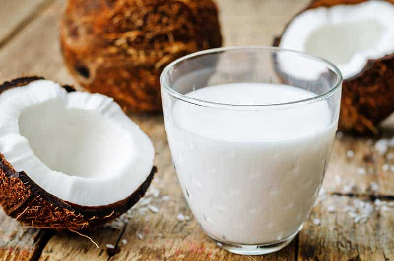 Glass of white coconut milk to be used as a Coconut cream substitute