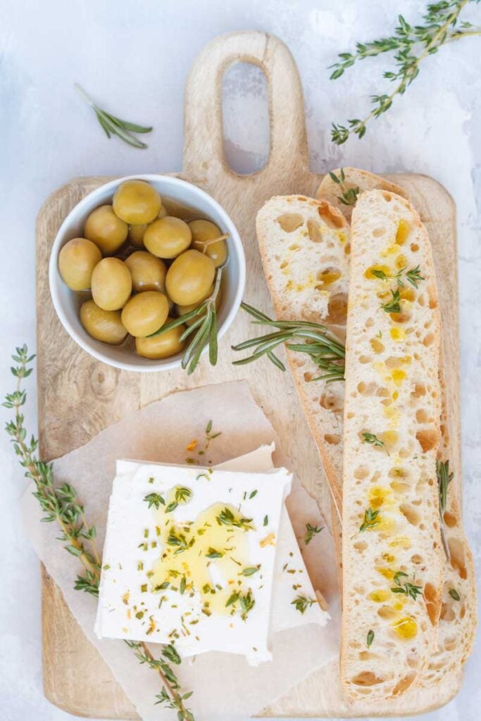Long bread and feta cheese and olives so you can freeze feta cheese 