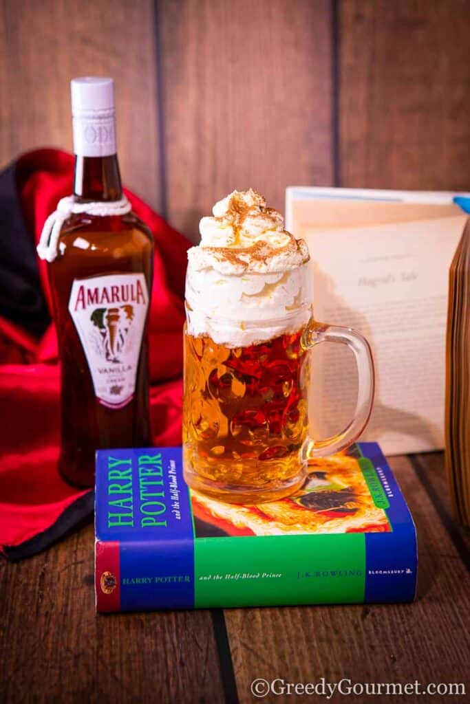 Butterbeer resting on Harry Potter & the half blood prince book