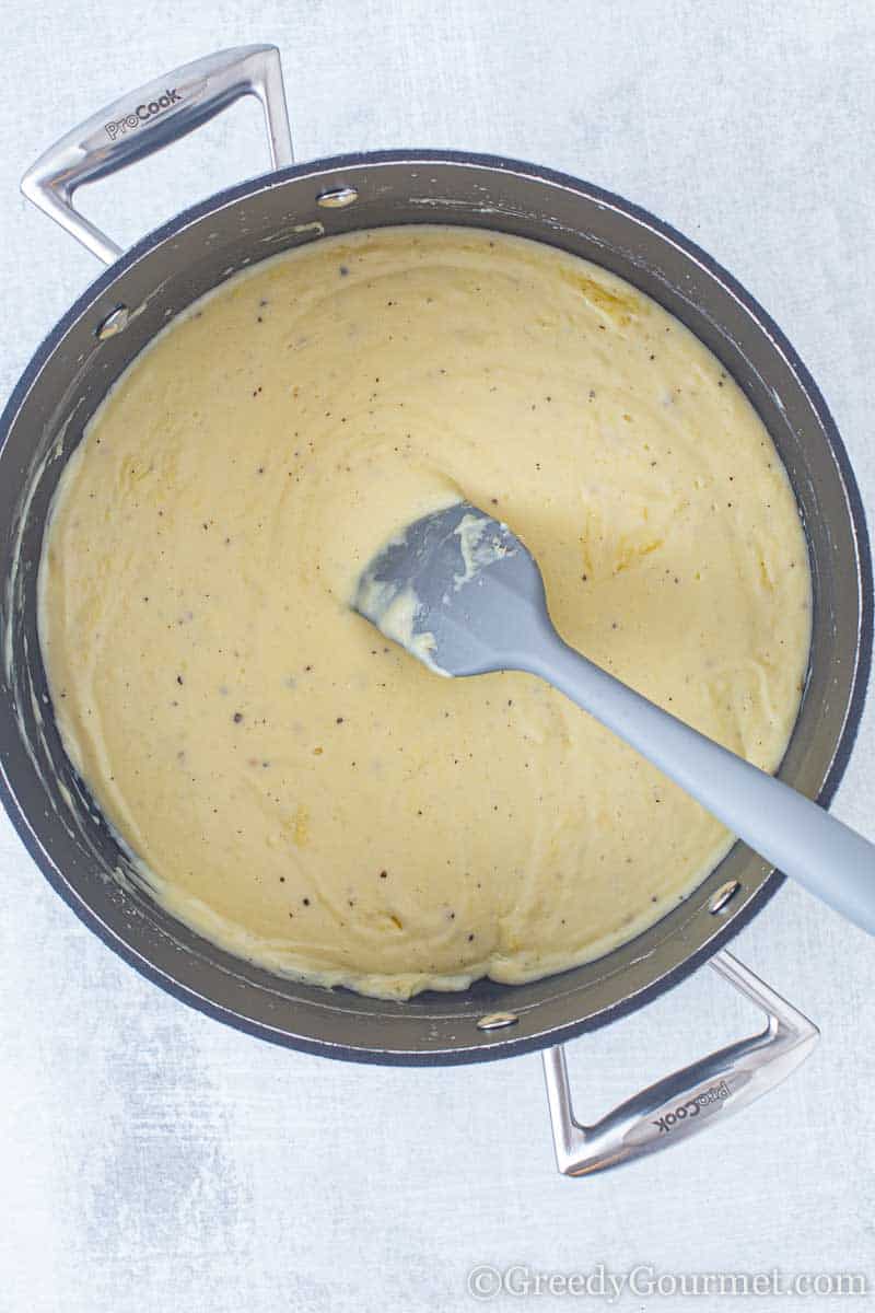 White sauce melting in a stock pot