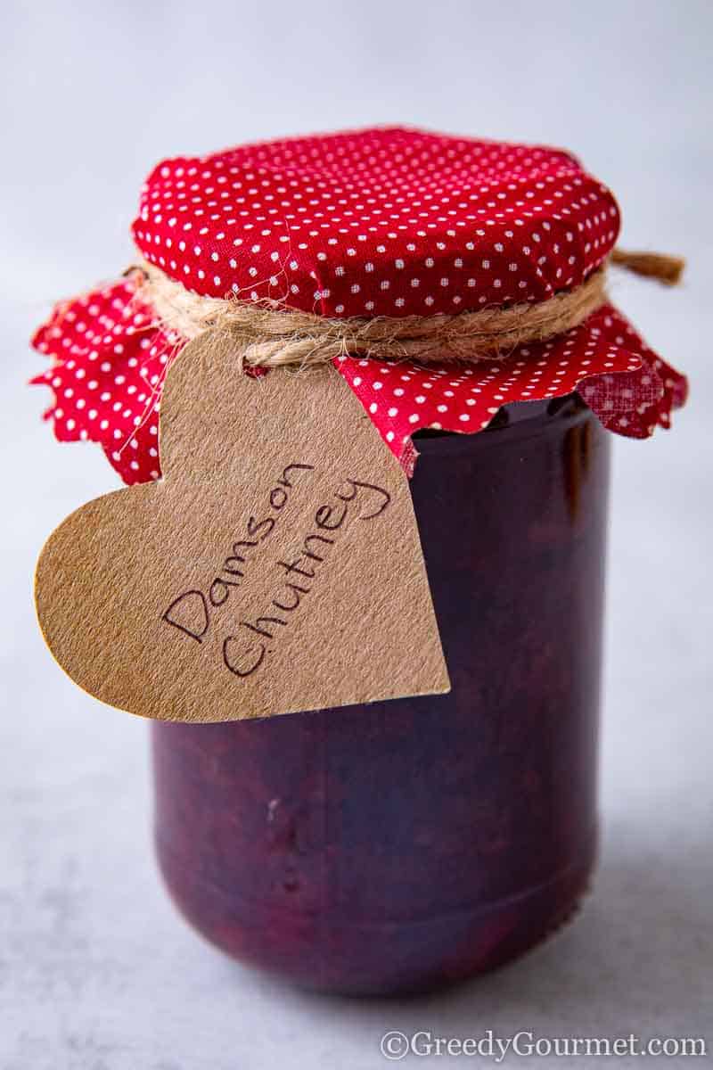 Jar of fresh jam to learn how to make a damson jam