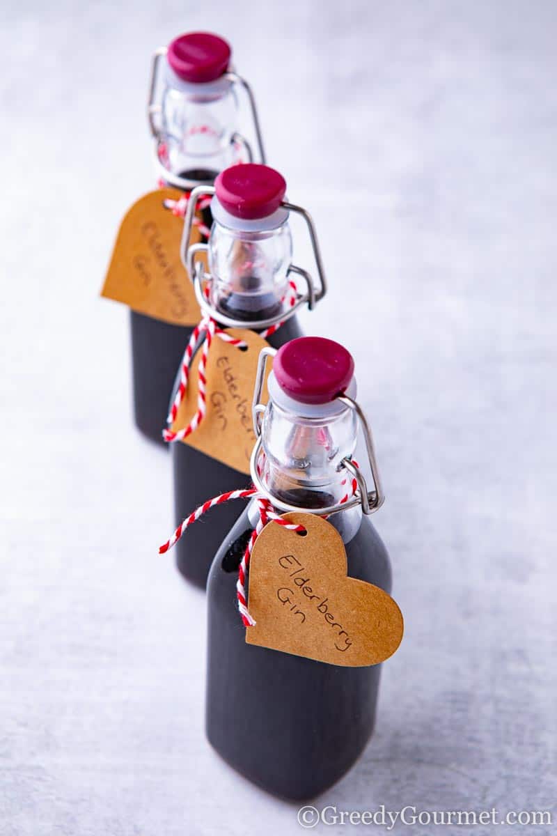 Three bottles of elderberry gin