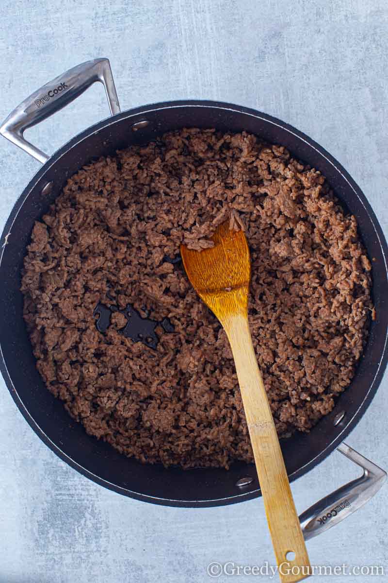 Meat browning in a pan to make a beef and potato recipe