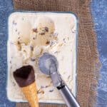 Scoops of fresh ice cream being removed from a container