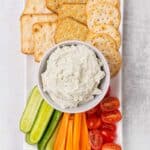 Blue cheese dip with crackers and vegetables