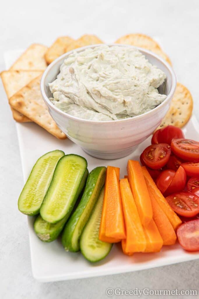 Bowl of blue cheese dip and fresh cut vegetables 