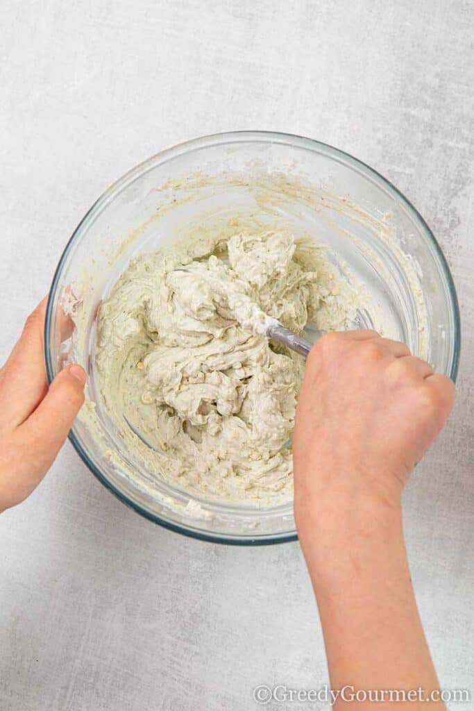 An easy veggie dip stirred in a bowl 