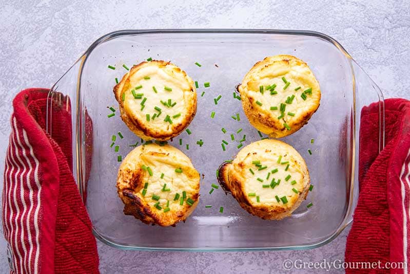 Four freshly baked twice baked cheese souffle