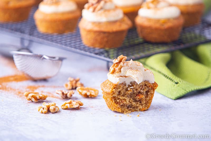 Bite removed from a carrot cake cupcake