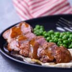 Full plate of a duck breast dish