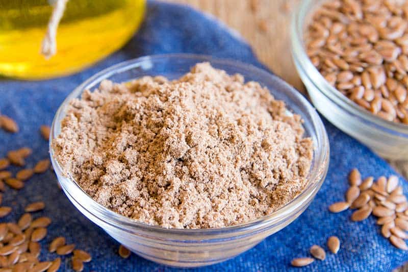 Bowl of brown ground flaxseed.