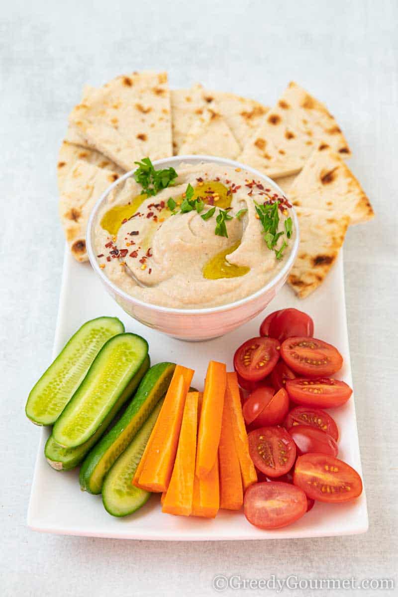 Bowl of mutabal and fresh cut vegetables