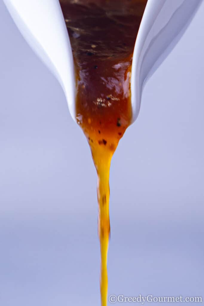 Orange sauce being poured