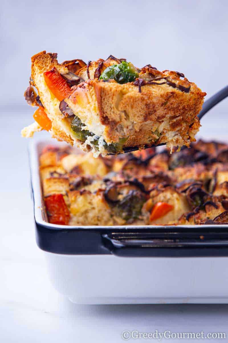 Colorful slice of savory bread pudding