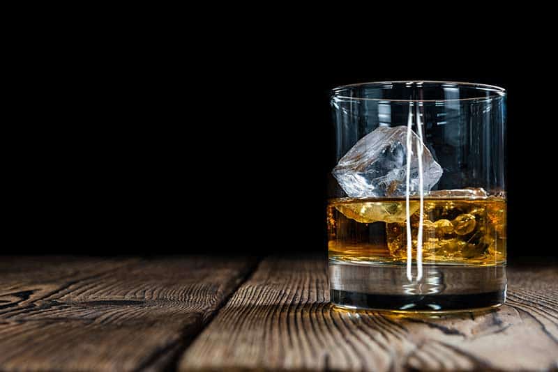 Small pour of bourban with ice to be used as a cognac substitute