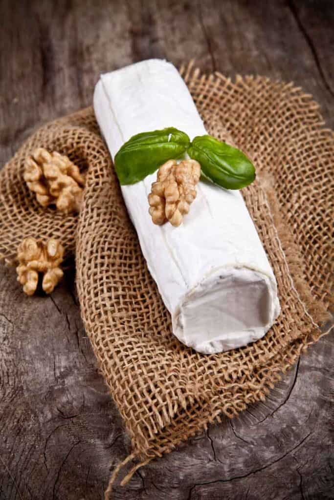 Log of white goat cheese