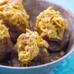 Close up of jacket potatoes filled with coronation chicken
