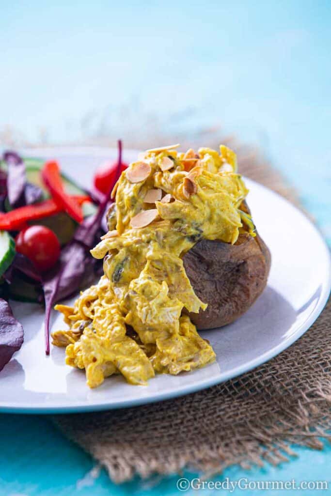 coronation chicken on a jacket potato with salad