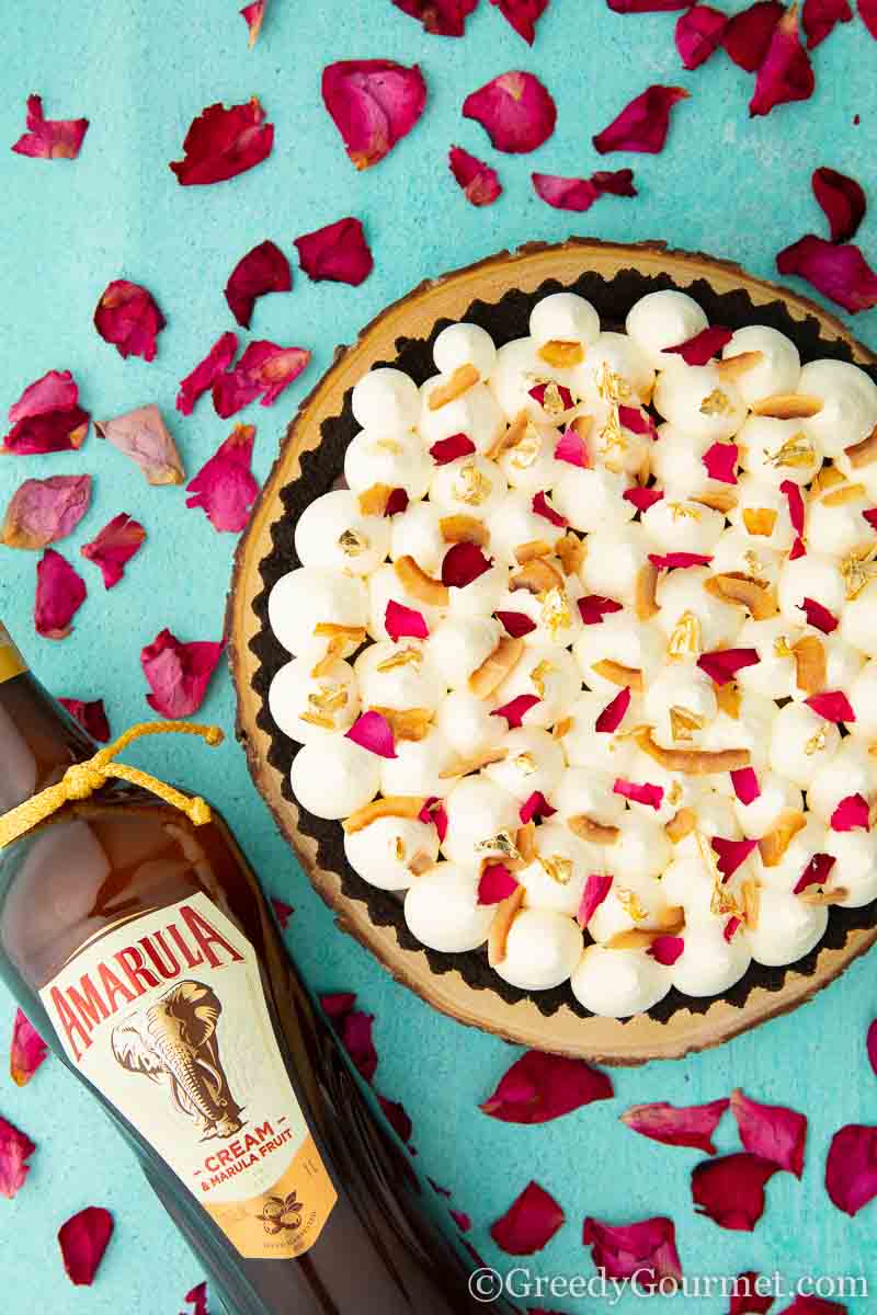 Whole chocolate custard pie with a bottle of Amarula