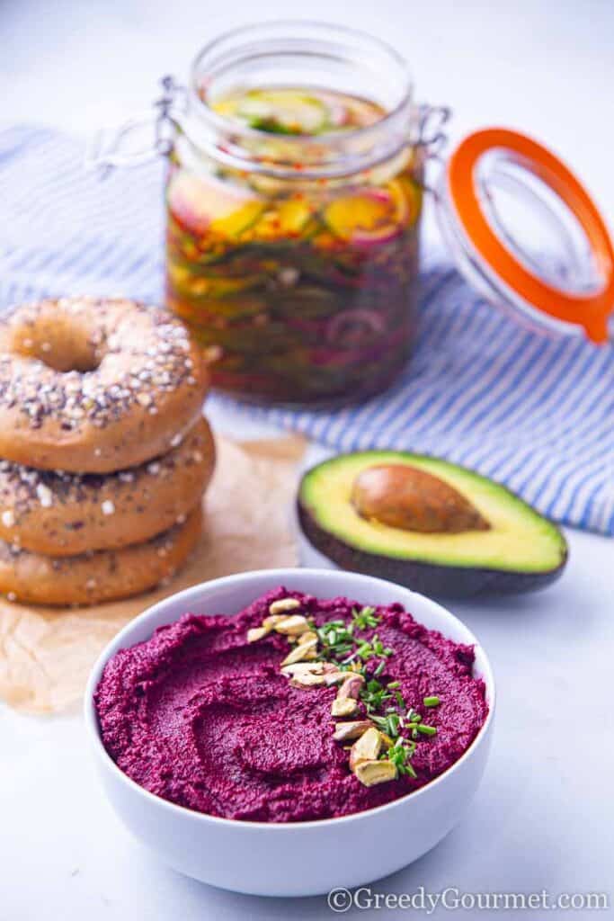 Bagels, avocado, beetroot hummus and pickled cucumber