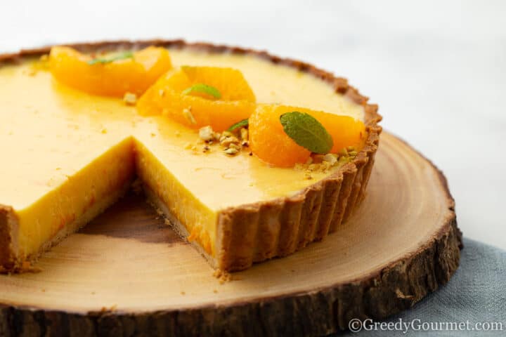 Orange tart topped with orange slices
