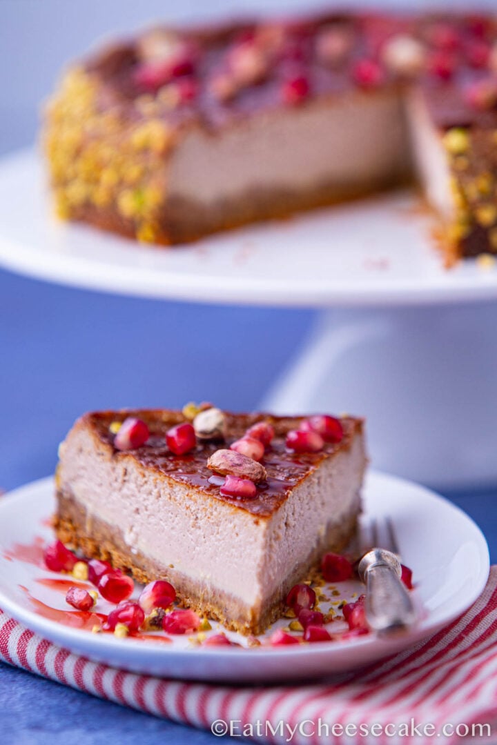 Slice of baked pomegranate cheesecake.