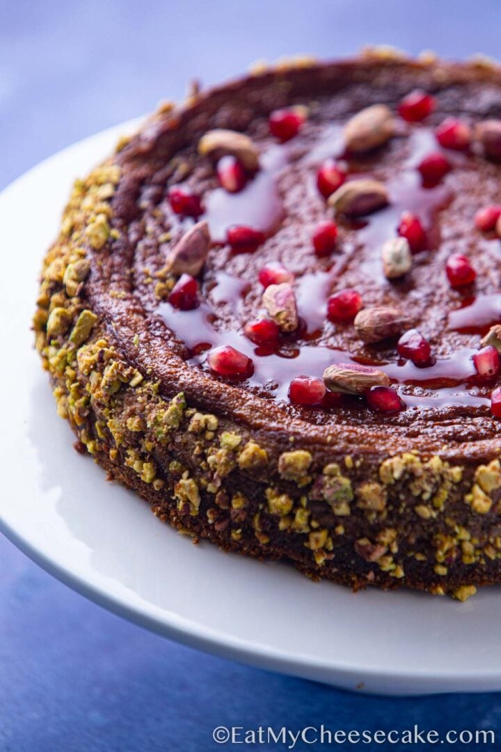 Decorated baked pomegranate cheesecake.