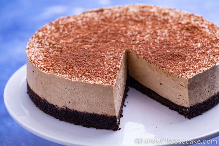 No bake espresso cheesecake dusted in cocoa powder.