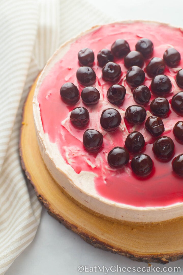 Top view of cherry cheesecake with lots of cherries as toppings.