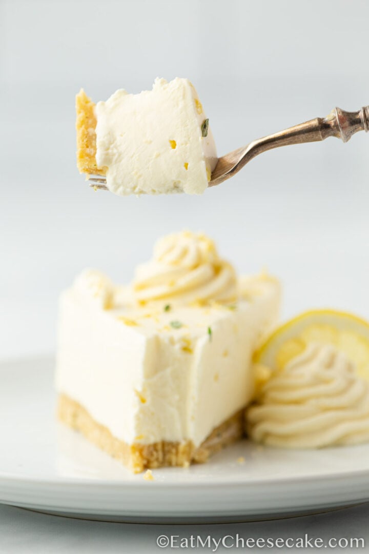 slice of lemon cheesecake on a plate.