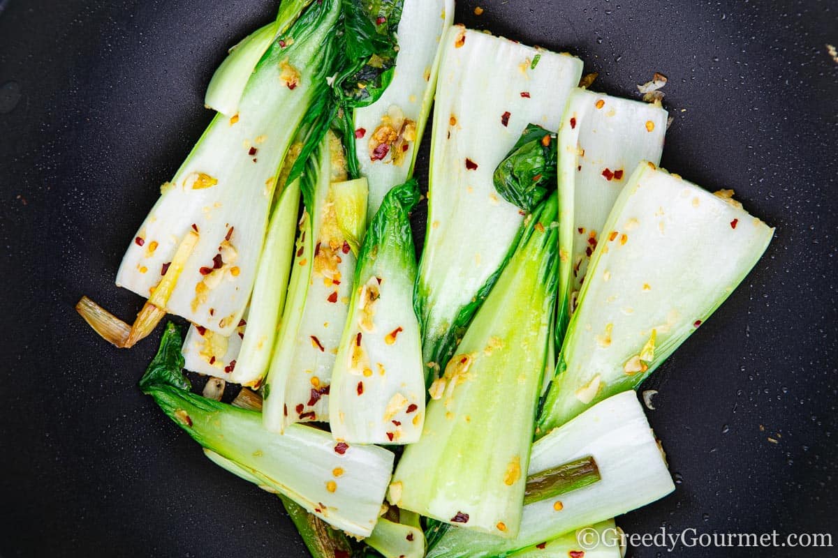 Plate of a vegan stir fry of bok choy.