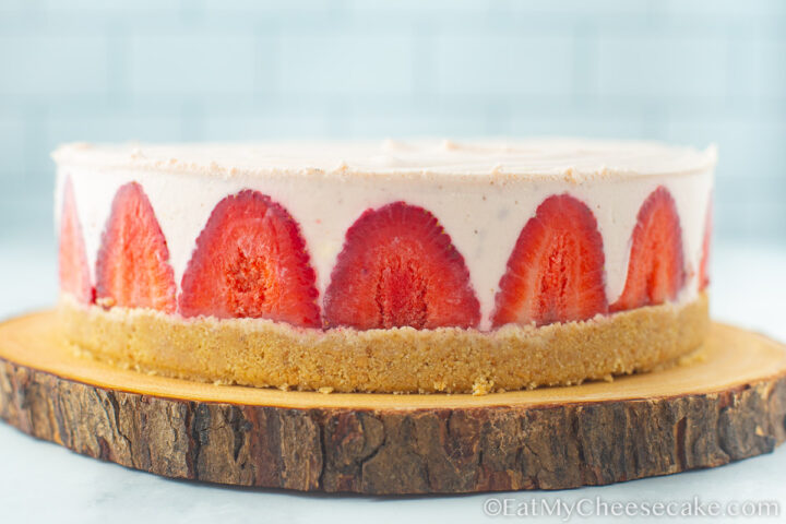side view of a strawberry cheesecake.
