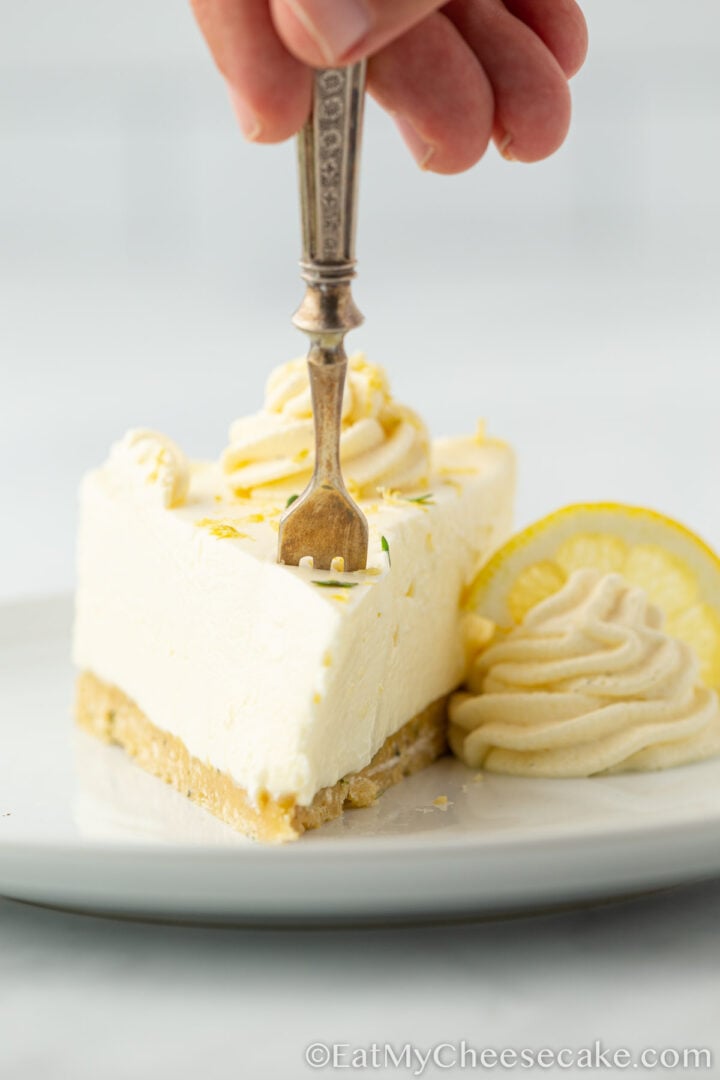 slice of lemon cheesecake on a plate.