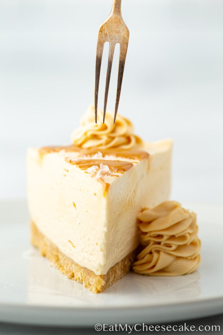 Slice cut out from no bake salted caramel cheesecake.