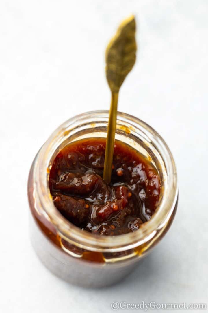 jar of strawberry chutney and a spoon.