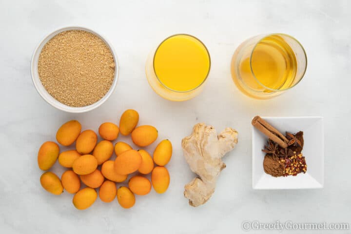 ingredients for kumquat chutney laid out on a table