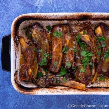 Ribs in a casserole dish to show you how to make a lamb ribs recipe